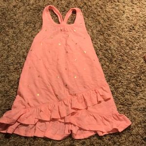 Orange tank top with gold dots and crossed bottom